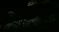 Lava Caves 05 Man walking from dark cave HD Footage