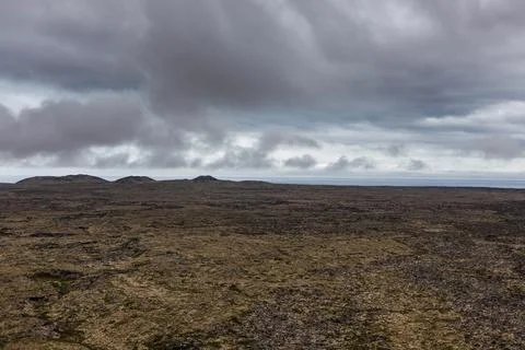 Lava fields and dramatic landscape in Iceland. Empty desolate Icelandic view. Illustrazione stock