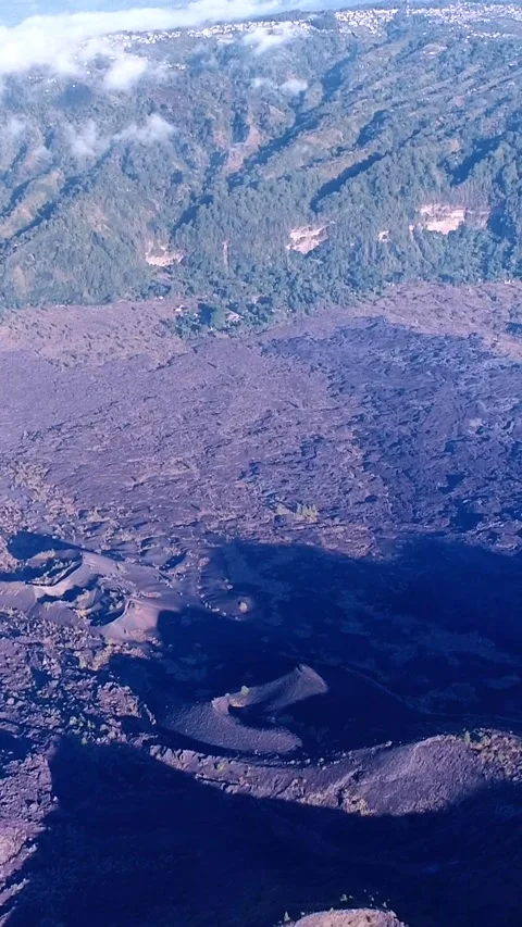 Lava fields at the bottom of volcano Stock Footage 228013353