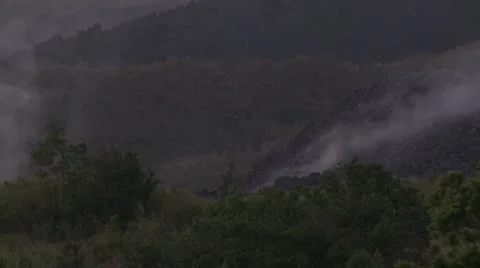 Lava Flow Burns Through Vegetation On Side Of Volcano Stock Footage 8926465