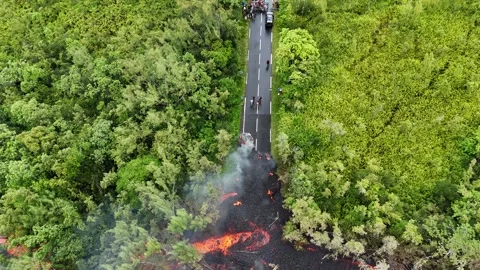 Lava flow crossing the road Stock Footage 330989897