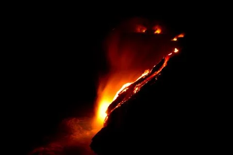 Lava flow at night Foto stock
