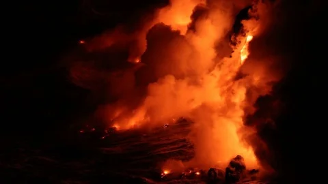 Lava flowing into the ocean from volcano lava eruption on Big Island Hawaii Stock Footage 69821917