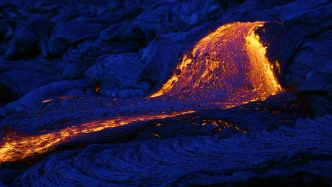 Lava flows at night, creating new rock, Hawaii Video stock 86184418