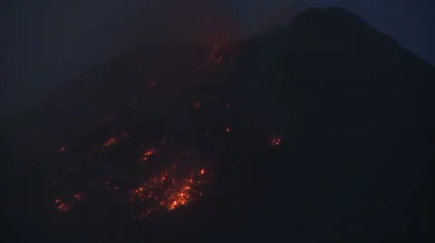 Lava Pours From Erupting Mayon Volcano At Night Stock Footage