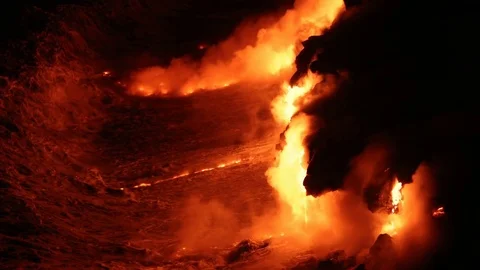 Lava reaches ocean from lava stream on Big Island Hawaii volcanic eruption Stock Footage
