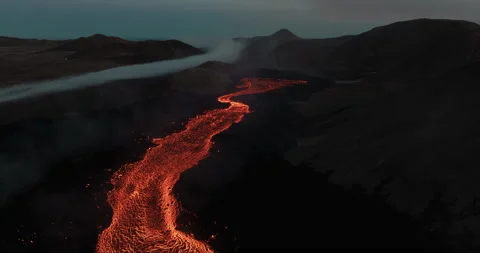 Lava river near active volcano in Iceland Aerial Video stock 247053637
