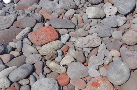 Lava rocks, rounded by the ocean Stock Photos