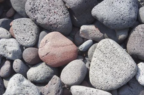Lava rocks, rounded by the ocean Stock Photos