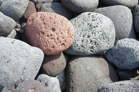 Lava rocks, rounded by the ocean Stock Photos