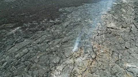 Lava rocks still cooling down near Geldingadalir active Volcano - Aerial view Stock Footage 233034070