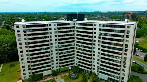 Laval Quebec Canada river shore white condo building drone dolly roll Vídeo Stock 247869859