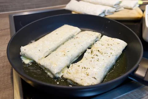 Lavash appetizer fried in a pan. Snack for party with friends. Stock Photos