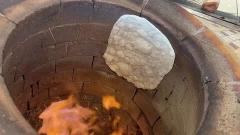 Lavash bread. Bread baked in a wood-fired tandoor Stock Footage 237432670