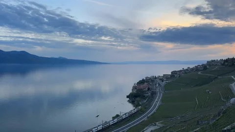 Lavaux vineyard train along Lake Geneva at sunset panoramic view Видео 333048448