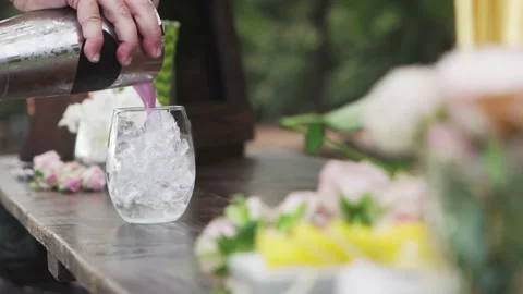 Lavender drink being poured by bartender at a party. Stock Footage 134846296