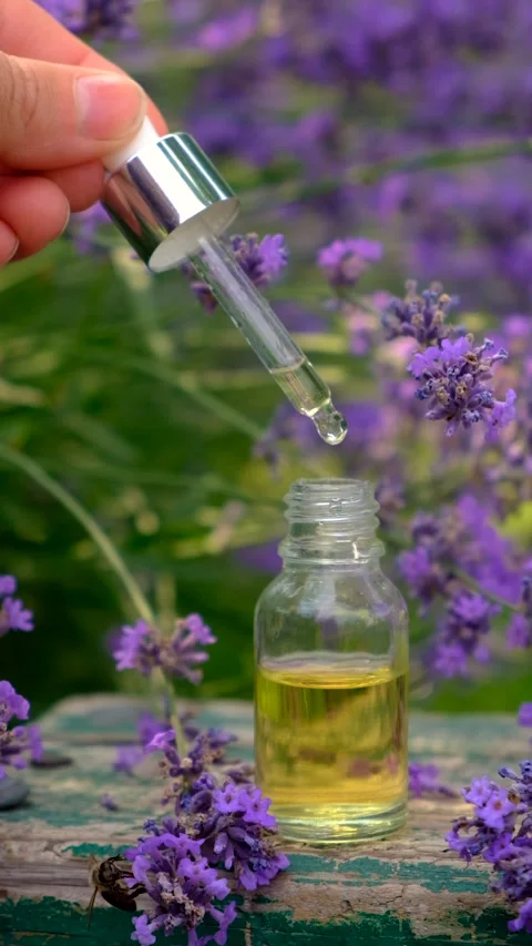 Lavender essential oil in a bottle. Selective focus. Stock Footage 314771663