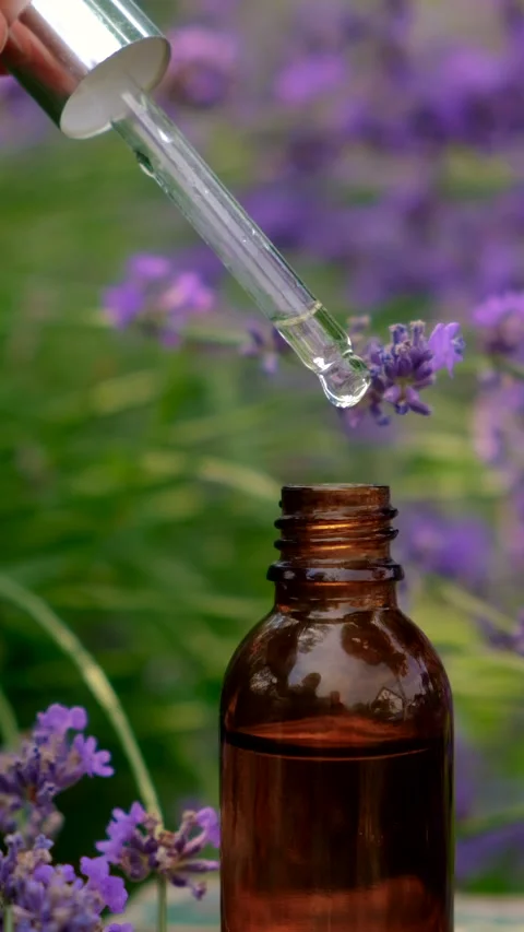 Lavender essential oil in a bottle. Selective focus. Stock Footage 315239035