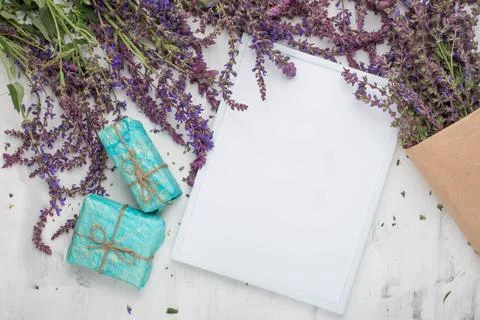 Lavender flowers with empty frame and gifts. Top view with empty space for in Stock Photos