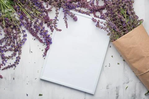 Lavender flowers with an empty frame. Top view with empty space for inscripti Stock Photos