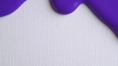 Lavender liquid drops of paint flow down on white paper. Macro photo. Purpl.. Stock Footage 261986769