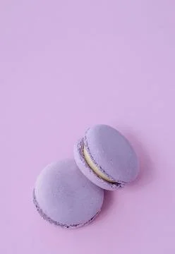 Lavender macarons on lilac flat lay background, colorful french dessert and.. Stock Photos