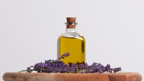 Lavender Oil rotating on a table Stock Footage 249950162