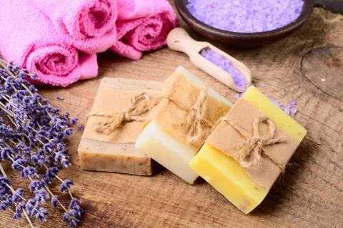 Lavender soap and salt on rustic wooden board. Spa concept Stock Photos