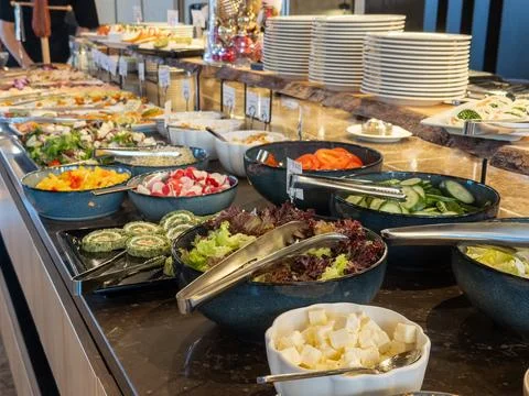 A lavish salad bar buffet featuring colorful bowls of fresh garden vegetables, Stock Photos