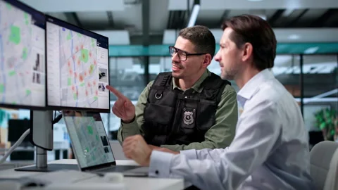 Law Enforcement Analysts Study Crime Patterns Stock Footage 346933012