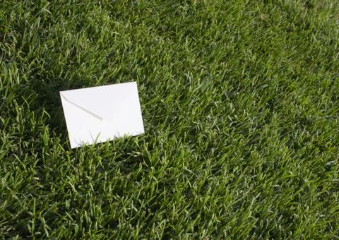 Lawn and an envelope Stock Photos