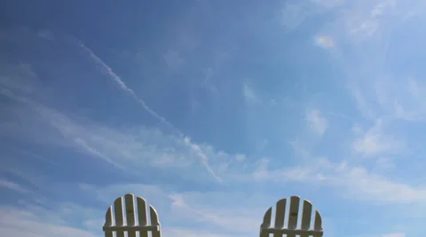 Lawn chairs with moving clouds Stock Footage 28022255