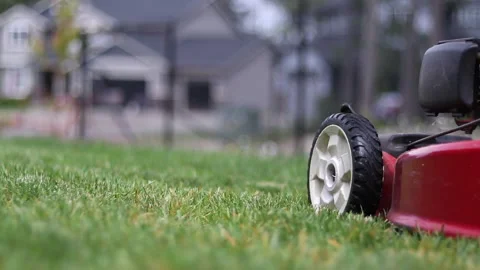 Lawn Mower ground level tracking shot Stock Footage 135080752
