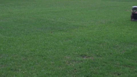 Lawn mower man, take care of mowing the grass in the football field. Video stock 87818341