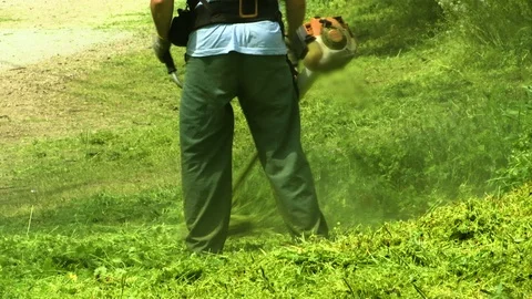 Lawn Mower Worker Man Cutting Grass In Green Field, Видео 88959685