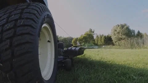 Lawn mower working in slow motion Stock Footage 191045369