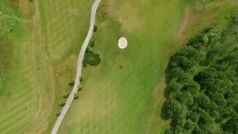 Lawn mowers on a golf course Stock Footage 76120876