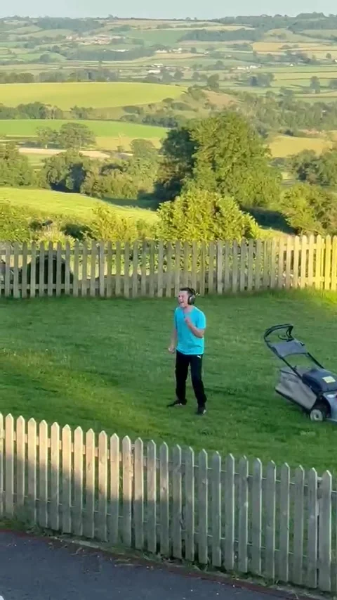 Lawn Mowing and Michael Jackson Moves, Bristol, UK - 18 Jun 2026 Stock Footage 337905446