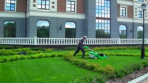 Lawn mowing with a machine Stock Footage 92615546