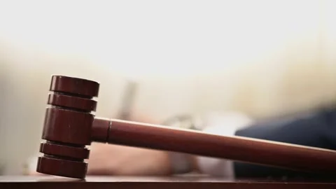 The lawyer is carrying a pen to write a case record in the courtroom Stock Footage 137517090
