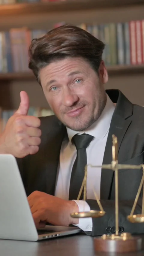 Lawyer Doing Thumbs Down while Working on Laptop, vertical Stock Footage 326256132