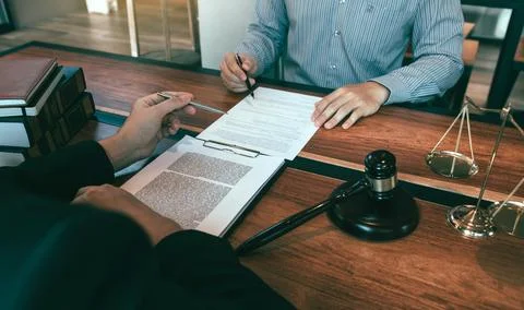 Lawyer is explaining about the wrongdoing laws regarding fraud to the clien.. Stock Photos