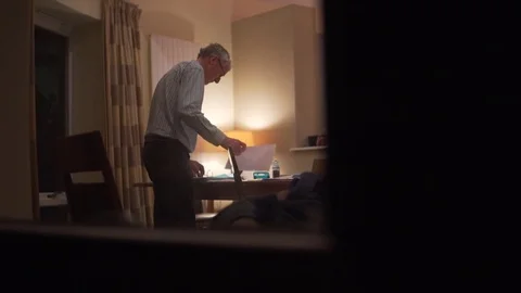 Lawyer Man Silhouette Working Late at a Desk, Organizing Case Papers Stock Footage