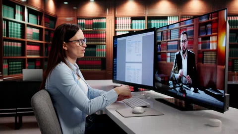 Lawyer Reviewing Documents And Contract With Colleague In Video Conference Call Stock Footage 330587937