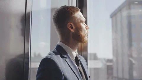 Lawyer riding elevator Stock Footage 121152124