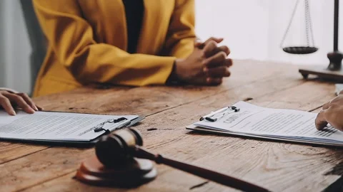 Lawyer shaking hands with a client making about documents, contracts, agree.. Stock Footage 277414182