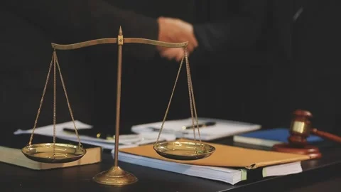 Lawyer shaking hands with a client making about documents, contracts, agree.. Stock Footage 289844066