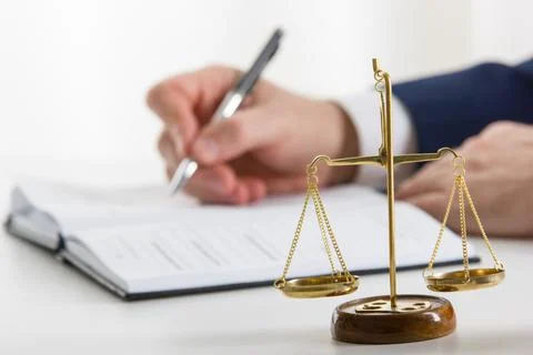 Lawyer working with contract papers and wooden gavel on tabel in courtroom Stock Photos