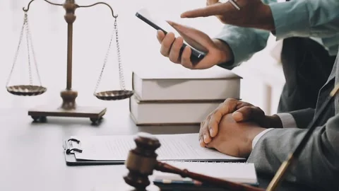 Lawyer write drafts a legal document at a desk with stationery and a laptop.. Stock Footage 304846999