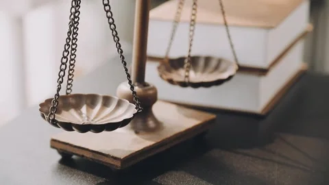 Lawyer write drafts a legal document at a desk with stationery and a laptop.. Stock Footage 304847001